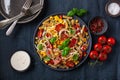 healthy pasta salad with zucchini sweet corn tomato and basil, vegetarian lunch Royalty Free Stock Photo