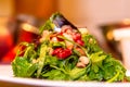 Healthy pearl barley salad with beans, cucumbers, red onion, sunflower seeds, pomegranate and parsley in bowl on