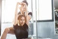 Healthy people asian young woman sport exercise in fitness gym sport club with personal trainer instructors help support Royalty Free Stock Photo
