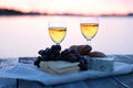 Healthy picnic for a summer vacation with freshly baked croissants, fresh fruit, vegetables, cheese laid out on a blue and white Royalty Free Stock Photo