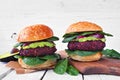 Healthy plant based beet burgers with avocado and spinach Royalty Free Stock Photo