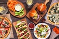 Healthy plant based fast food table scene. Overhead view on a wood background.