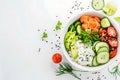 Healthy poke bowl salad meal of Salmon, avocado, cucumber, tomato, beans and rice on white background Royalty Free Stock Photo