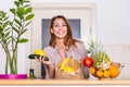 Healthy positive happy woman holding a paper shopping bag full of fruit and vegetables. Young woman holding grocery shopping bag Royalty Free Stock Photo