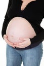 Healthy pregnancy concept pregnant woman holding her stomach Royalty Free Stock Photo