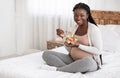 Healthy Pregnancy Nutrition. Happy Pregnant African American Woman Eating Fresh Vegetable Salad