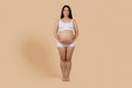 Healthy Pregnancy. Portrait Of Smiling Young Expectant Female In Underwear