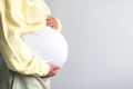 healthy pregnancy. Side view pregnant woman with big belly advanced pregnancy in hands. Banner copyspace for text Royalty Free Stock Photo