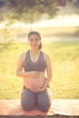 Healthy pregnant woman doing yoga in nature outdoors. Royalty Free Stock Photo