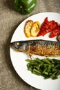 Healthy and proper food, grilled fish and vegetables Royalty Free Stock Photo