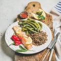 Healthy protein rich dinner plate with roasted salmon and quinoa