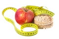 Healthy puffed corn galettes and red apple with measuring tape