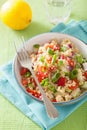 Healthy quinoa salad with tomato cucumber onion chives