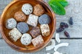 Healthy raw energy balls with cocoa, coconut, sesame, chia in a wooden bowl. Royalty Free Stock Photo