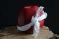 HEALTHY RED APPLE WITH WHITE GAUZE BANDAGE Royalty Free Stock Photo