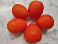 healthy and refreshing organic tomatoes on white table