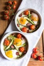Healthy and rich breakfast with baked eggs and vegetables