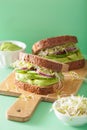 Healthy rye sandwich with avocado cucumber alfalfa sprouts Royalty Free Stock Photo