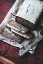 Rye Swedish bread loaf cut in slices with vintage knife Royalty Free Stock Photo