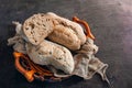 Healthy rye wholegrain bread in a brown Kraft basket on a farmer`s wooden table. Homemade cake Royalty Free Stock Photo