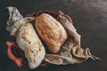 Healthy rye wholegrain bread in a brown Kraft basket on a farmer`s wooden table. Homemade cake Royalty Free Stock Photo