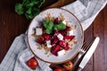 Healthy salad with beetroot, pearl barley, cilantro and brynza cheese, top view