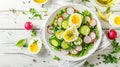 Healthy salad with boiled eggs, cucumbers, radishes, and a mix of greens