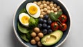 Healthy salad bowl with avocado, chickpeas, spinach, cherry tomatoes and blueberries.