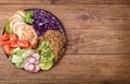 Healthy salad bowl with quinoa, chicken, avocado and vegetables .