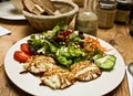 Healthy salad and bread on wood table