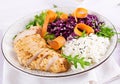 Healthy salad. Buddha bowl dish with chicken fillet, rice, red cabbage, carrot