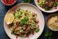 Healthy salad with couscous, fresh mint, cucumber, pomegranate, lemon and olive oil.