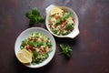 Healthy salad with couscous, fresh mint, cucumber, pomegranate, lemon and olive oil.