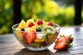 Healthy salad diet fruit dessert colorful kiwi fresh food bowl strawberry breakfast vegetarian Royalty Free Stock Photo