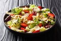 Healthy salad of farfalle pasta with avocado, strawberries, fresh lettuce and balsamic sauce close-up on a plate. horizontal Royalty Free Stock Photo