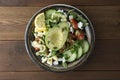 Healthy salad of fresh vegetables - tomatoes, avocado, arugula, egg, spinach. Flat lay. Top view Royalty Free Stock Photo