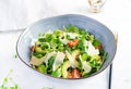 Healthy salad of fresh vegetables - tomatoes, avocado, corn salad, pea sprouts and chia seeds in bowl. Royalty Free Stock Photo