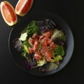 Healthy salad grapefruit and green leaves. Deliciouse dietary food. lose weigh. Square iamge, top view.