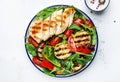 Healthy salad with grilled chicken breast fillet and vegetables: paprika, zucchini, eggplant, fresh tomatoes and mixed herbs. Royalty Free Stock Photo