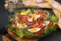 Healthy salad of organic salad with canned tuna, tomatoes, chicken eggs and red onion Royalty Free Stock Photo