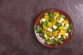 Healthy salad with persimmon, doucette lambs-lettuce, cornsalad, feld salad and feta cheese. Fitness food, superfoods vitamin Royalty Free Stock Photo