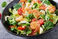 Healthy salad plate. Fresh seafood recipe. Grilled shrimps and fresh vegetable salad and egg. Grilled prawns Royalty Free Stock Photo