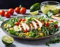 Healthy salad with quinoa, cherry tomatoes, chicken meat, avocado, lime and mixed greens, lettuce, parsley on a wooden table. Royalty Free Stock Photo