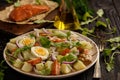 Healthy salad with salmon, potatoes, eggs and ruccola. Royalty Free Stock Photo