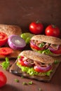 Healthy sandwich with ham tomato and lettuce Royalty Free Stock Photo