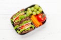 Healthy school lunch box with sandwich and fresh vegetables Royalty Free Stock Photo