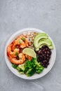 Spicy Shrimp Burrito Buddha Bowl with wild rice, broccoli, black beans and avocado Royalty Free Stock Photo