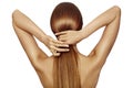 Healthy Shiny Long Hair in Tale. Beautiful Girl holding her Hair in hand. Back view on white. Hairstyle with strong Hair