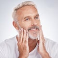 Healthy skincare, mature man and touching face on studio background. Mature guy, clean beard or facial cosmetics of male