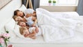 Healthy sleep. happy family parents and children sleeping in white bed Royalty Free Stock Photo